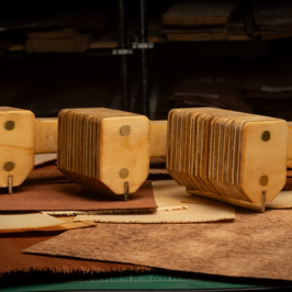 Three wood veneer hammers at different widths